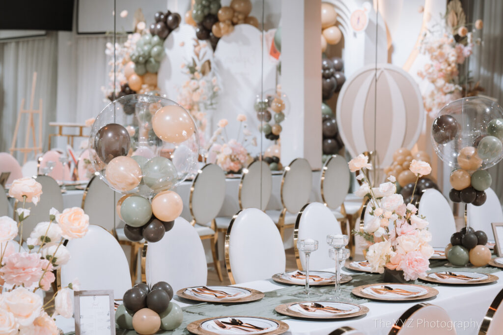 Elegant event setup with balloons and flowers