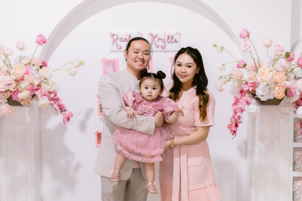 Family celebrating baby's first birthday.