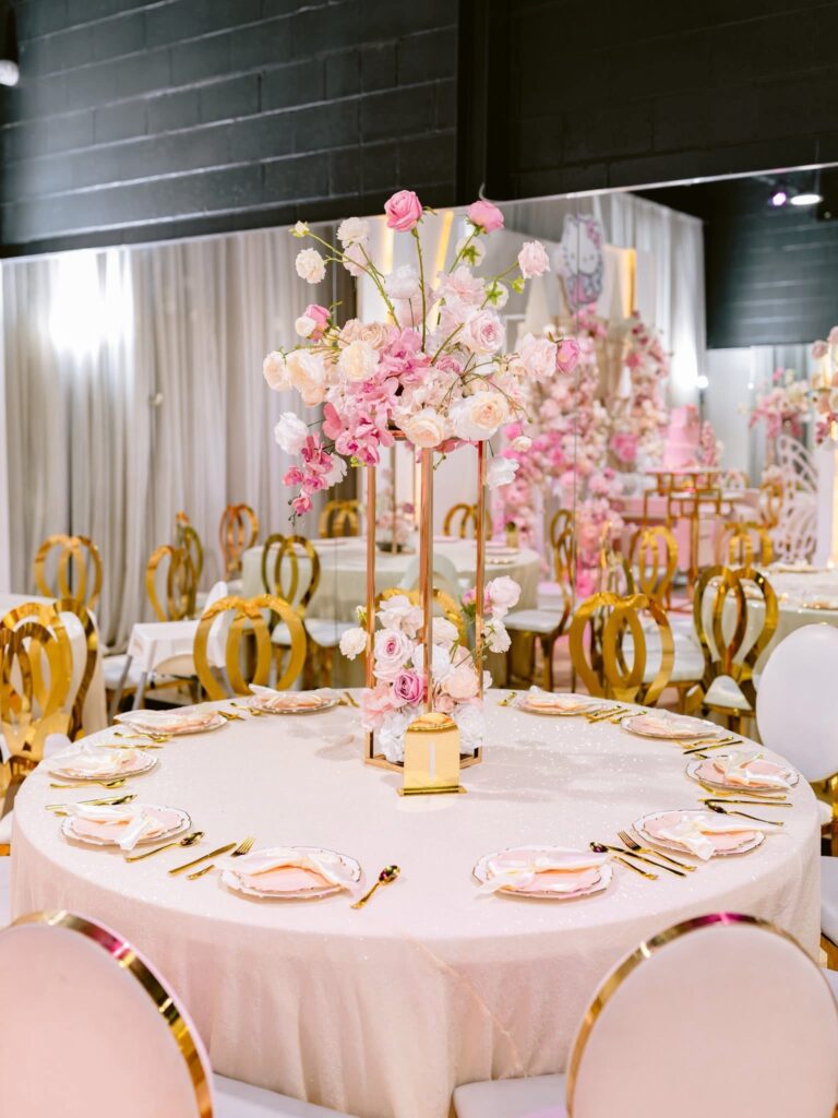 Elegant table setting with floral centerpiece.