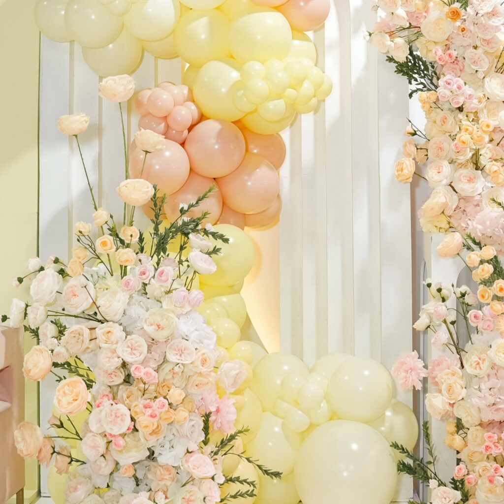 Pastel balloons and floral arrangements decor