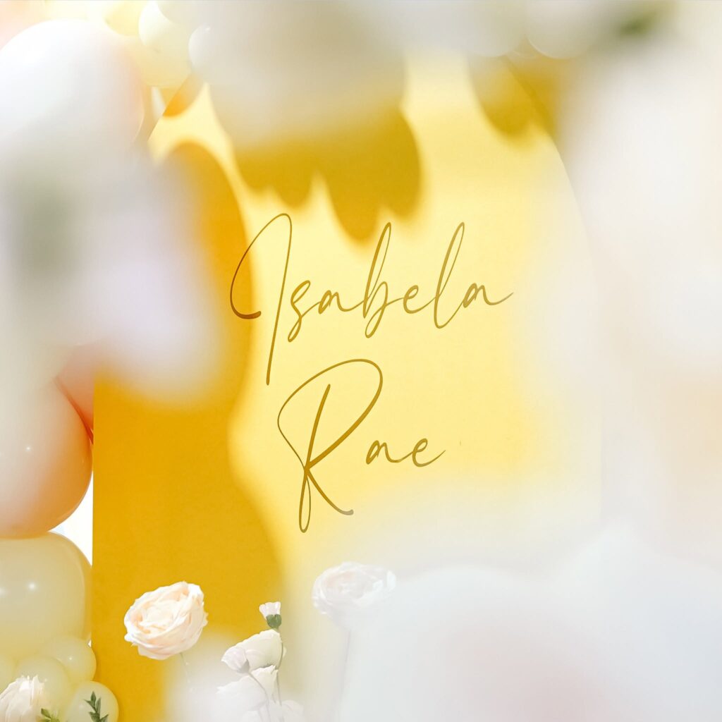 Yellow backdrop with floral decorations.